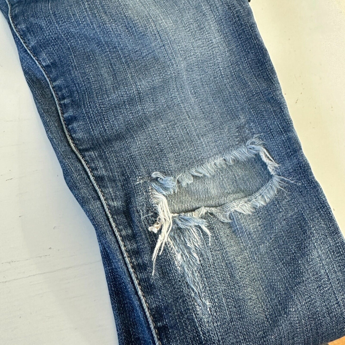 Revolve AG Flyaway The Stilt Cigarette Roll-Up Medium Wash Distressed Jean 27