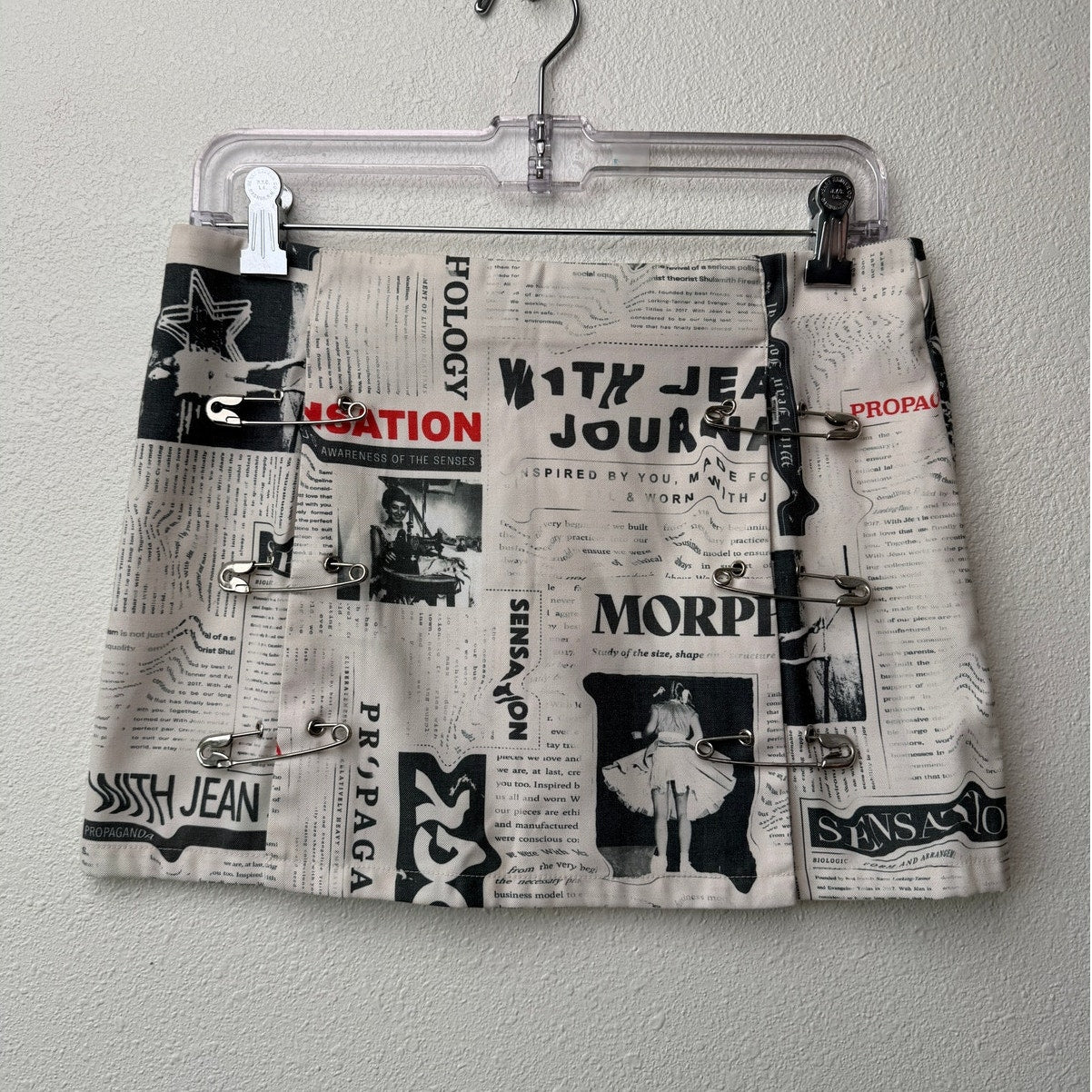 With Jéan Ivory Newspaper Print Safety Pin Mini Skirt