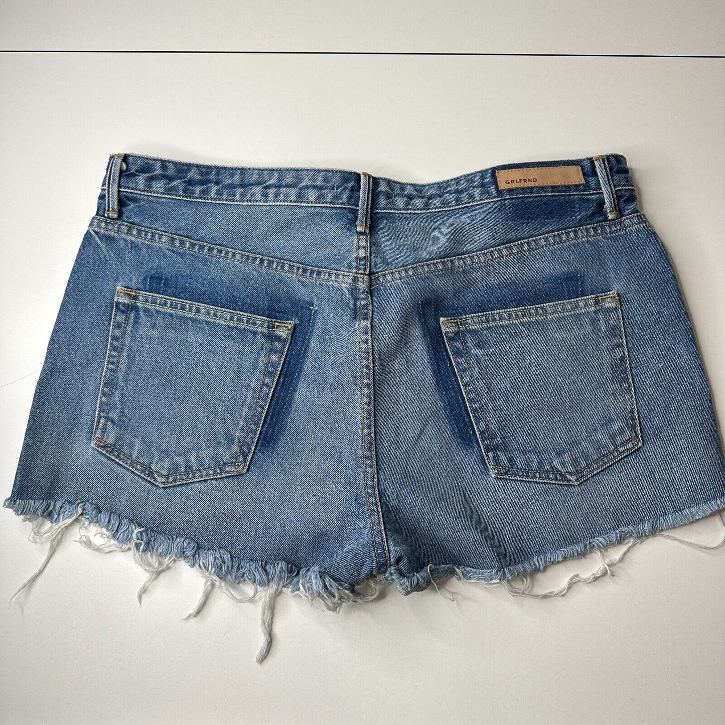 GRLFRND Cindy Button Fly High Rise Medium Blue Wash CutOff Jean Short Raw Hem 32