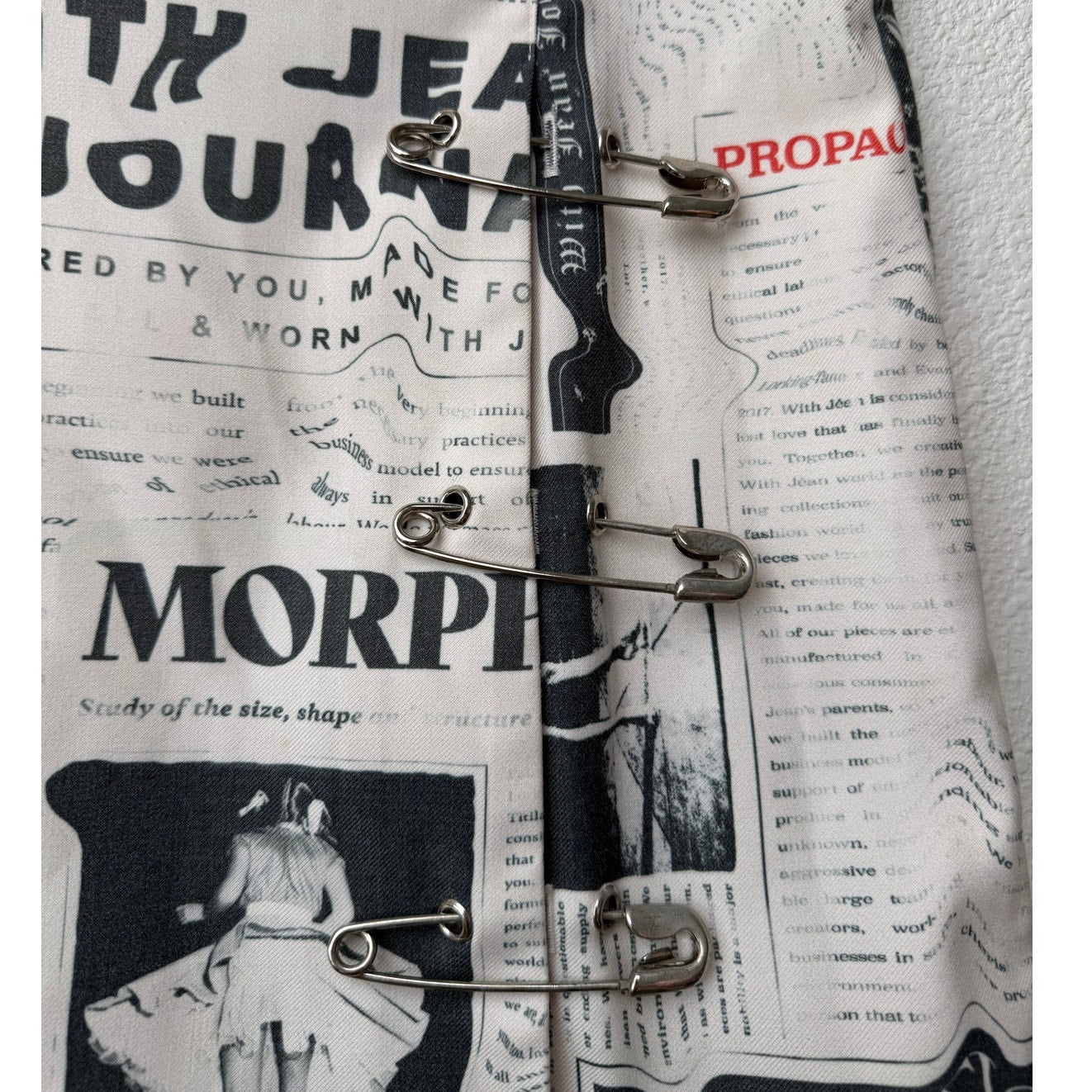 With Jéan Ivory Newspaper Print Safety Pin Mini Skirt