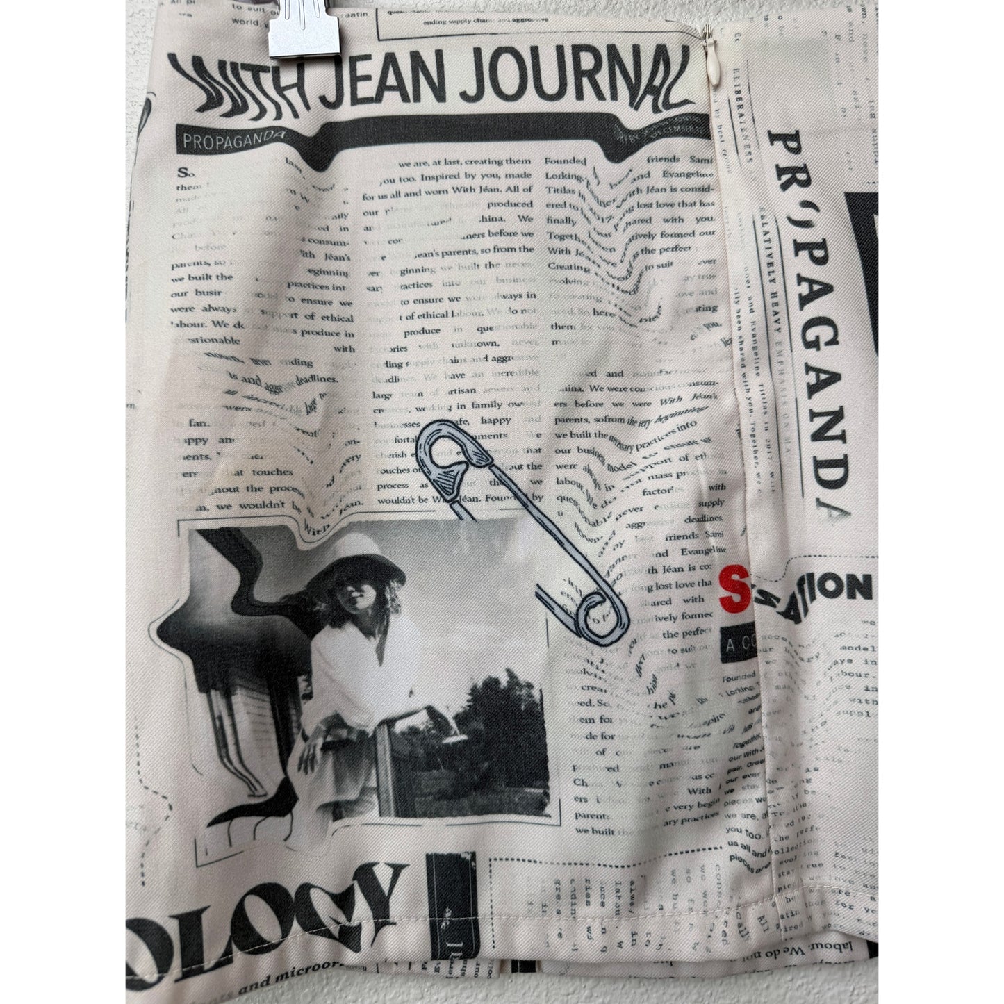 With Jéan Ivory Newspaper Print Safety Pin Mini Skirt