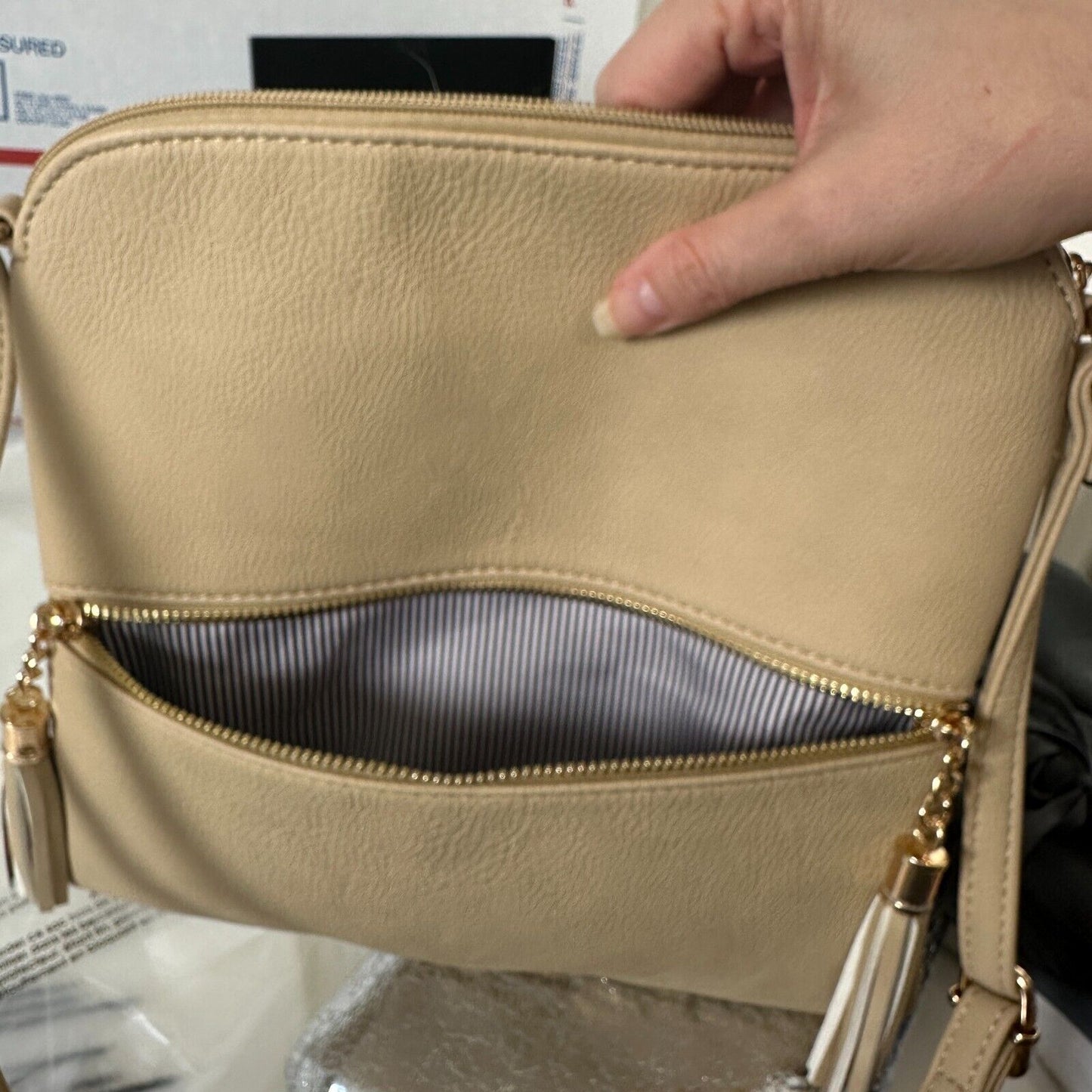 Desert Sand Tan and Gold Crossbody Bag Tassel Blue White Striped Interior Strap