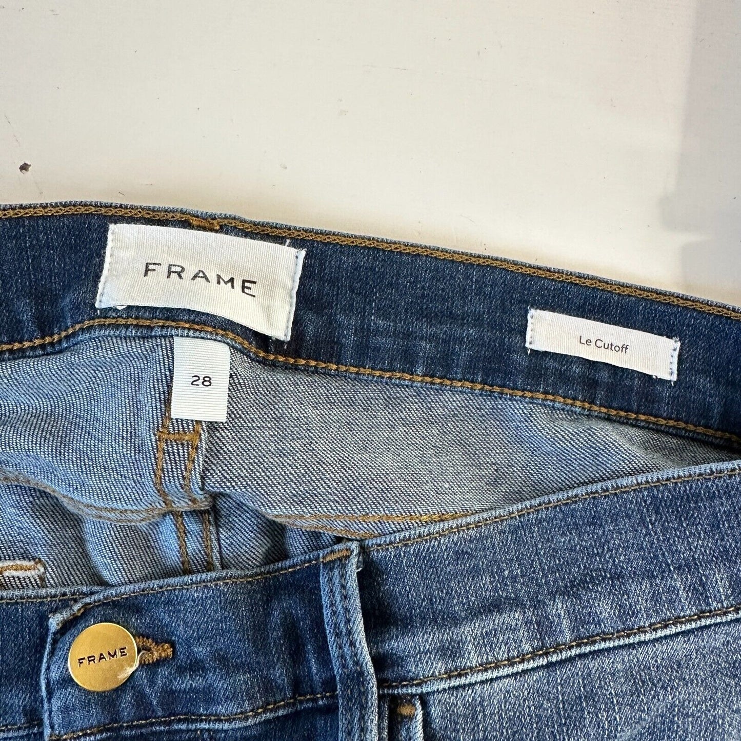 Frame Le Cutoff Medium Blue Wash Distressed Raw Hem Front Zip Jean Shorts 31