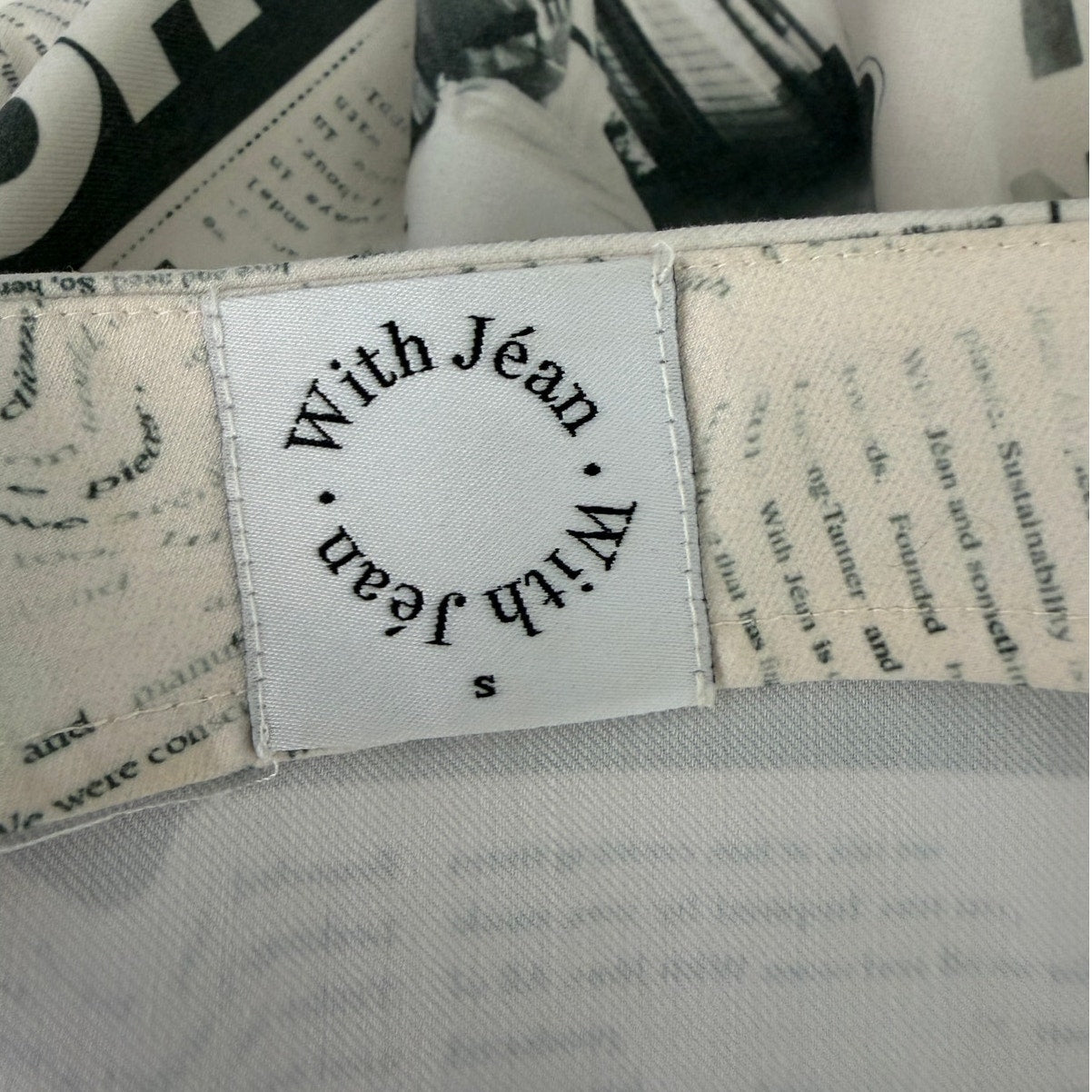 With Jéan Ivory Newspaper Print Safety Pin Mini Skirt