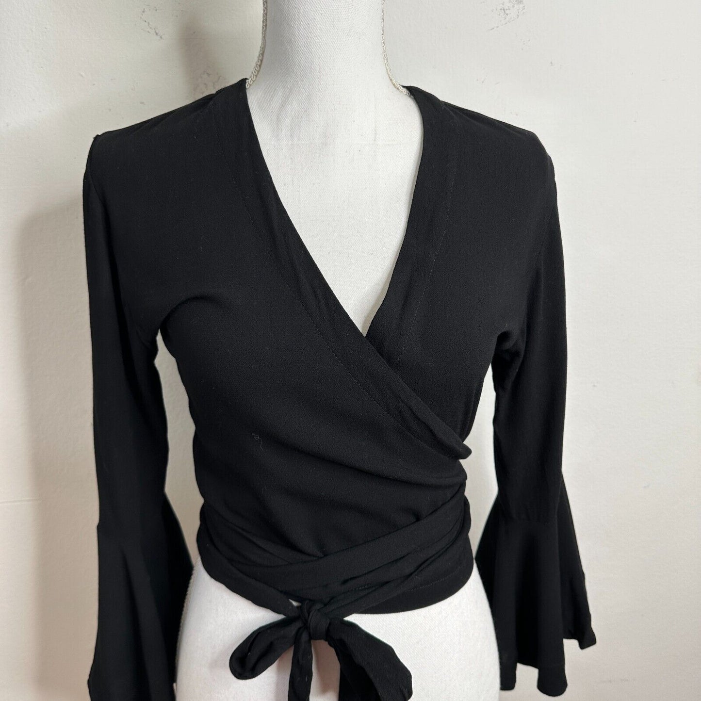 NWT Revolve Indah Lucia Black Wrap Tie Waist Top Plunging VNeck Bell Sleeves XS