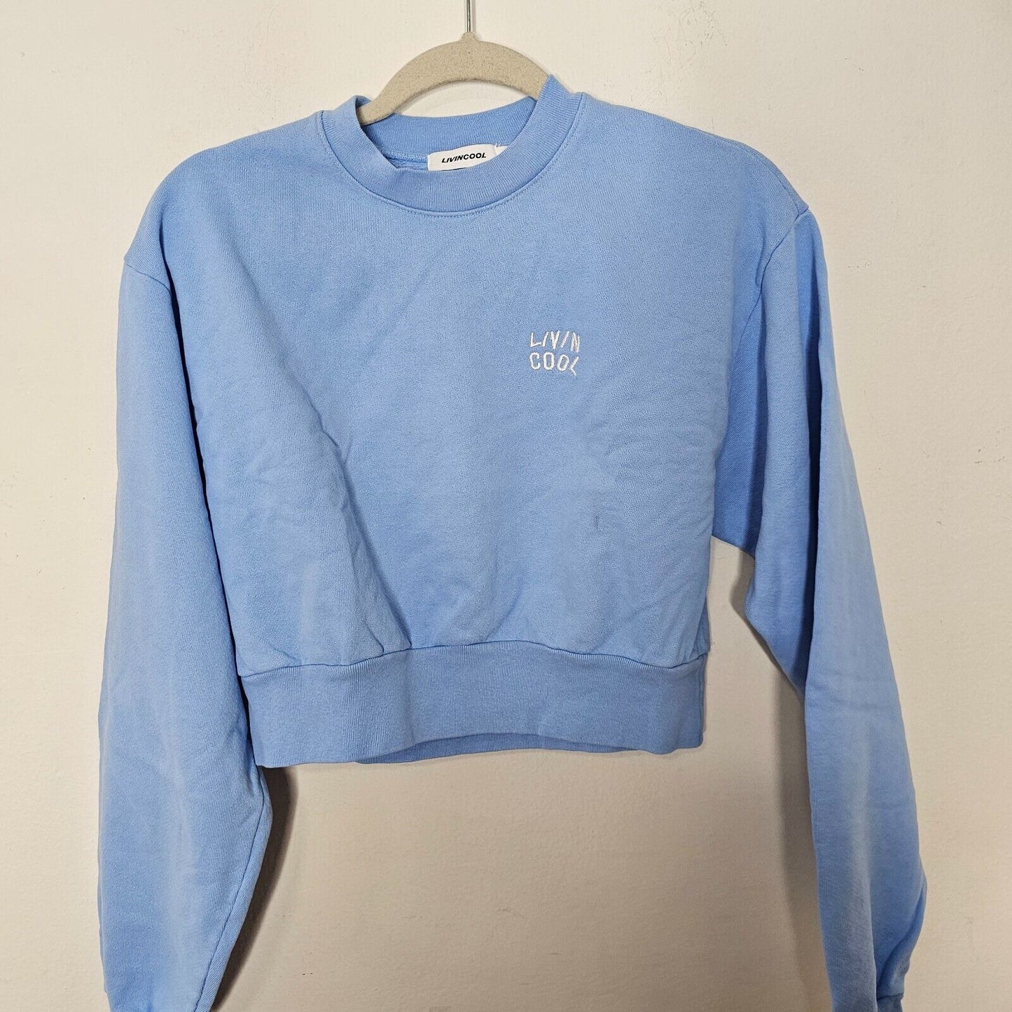 NWOT Living Cool Baby Blue Embroidered Wavy Logo Cropped Long Sleeve Sweatshirt