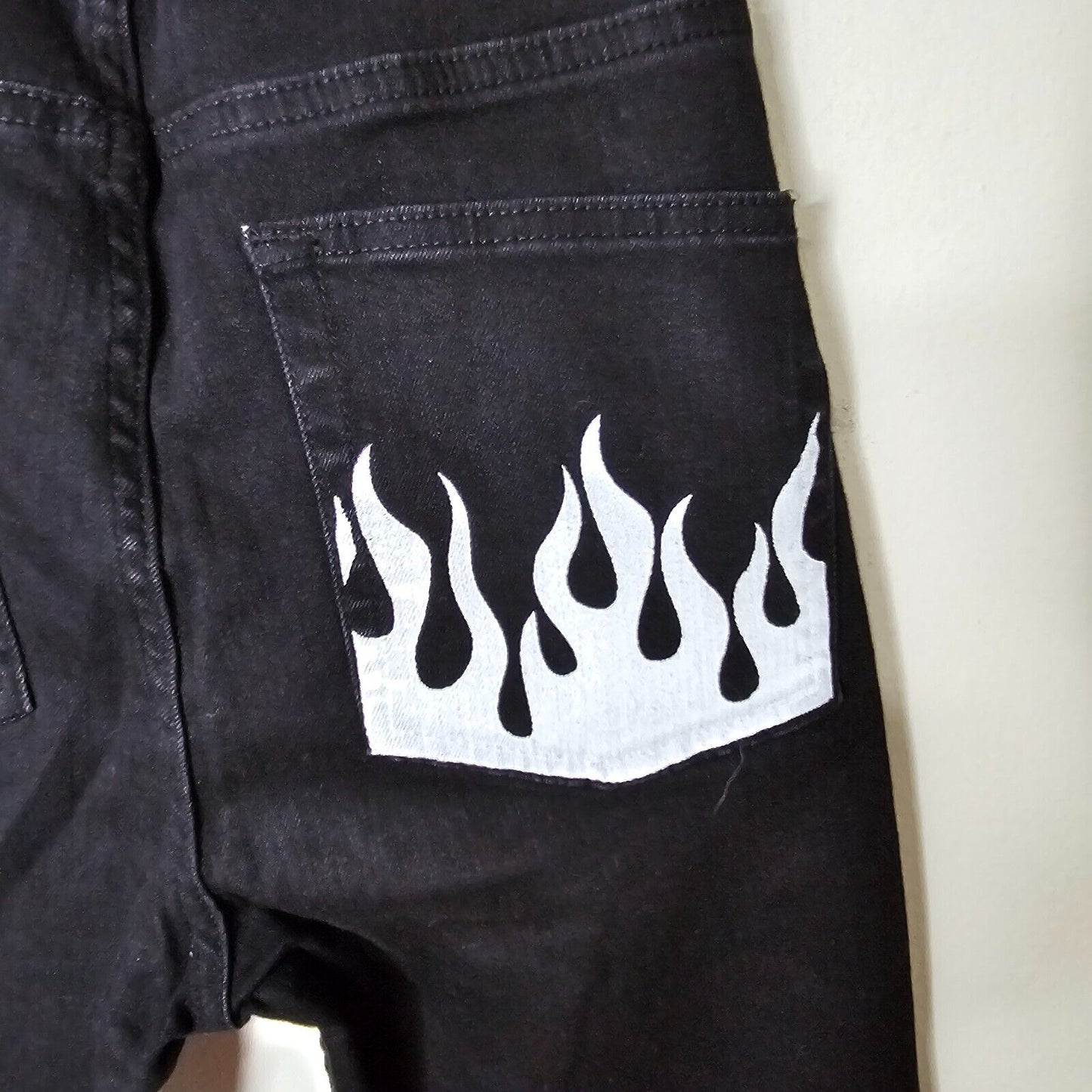 NWT Subdued Black Crop Flare Button Fly Raw Hem Front and Pocket White Flames 26